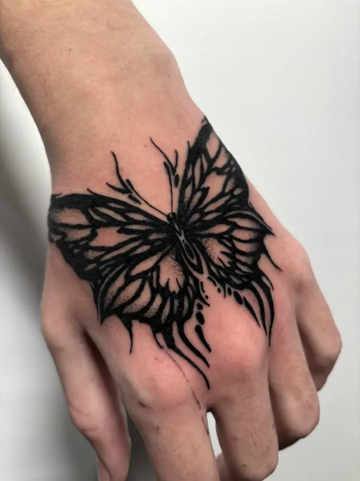 Tribal Butterfly Hand — Blackwork tattoo by Nillattt, photo 1